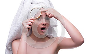Woman in beauty concept with magnifying glass aging wrinkles