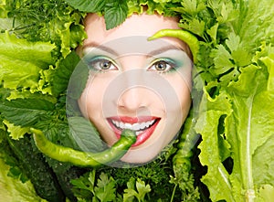 Woman beauty face with greens vegetables and pepper frame