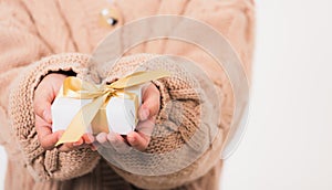 Woman beauty hands holding small gift package box present