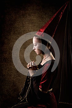 Woman Beauty in Middle Ages, Praying Young Girl in Medieval Cone Hat, Old History Portrait photo