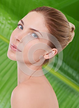 Woman, beauty and portrait with leaves, palm tree and sustainability for organic cosmetics. Girl, person or model with