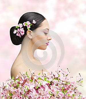 Woman Beauty Portrait in Sakura Flower, Asian Girl Bun Hairstyle