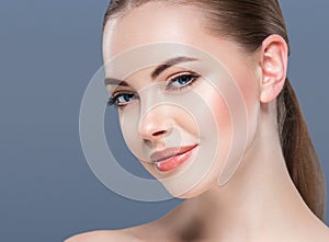 Woman beauty portrait skin care concept on blue background.