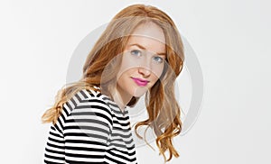 Woman beauty power. Close up of red haired girl face, leather jacket  on white background. Skin care, blue eyes