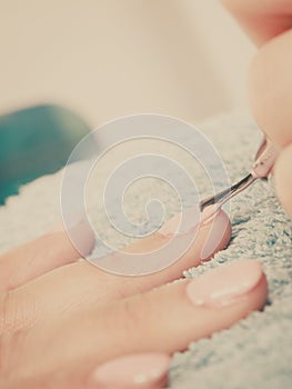 Woman in beauty salon getting manicure done.