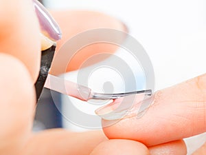 Woman in beauty salon getting manicure done