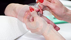 Woman in a Beauty Salon receiving a manicure