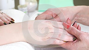 Woman in a Beauty Salon receiving a manicure