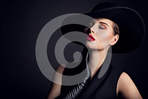 Woman Beauty in wide brim Hat, Elegant Fashion Model Retro Portrait on Black photo