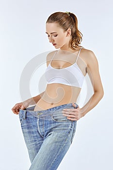 Woman became skinny and wearing old jeans