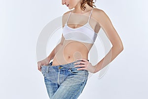 Woman became skinny and wearing old jeans