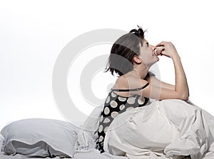 Woman in bed awakening