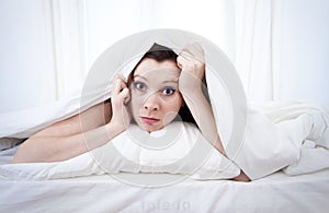 Woman in bed with insomnia that can't sleep white background photo