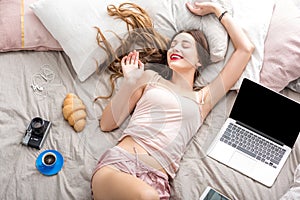 Woman on the bed with laptop