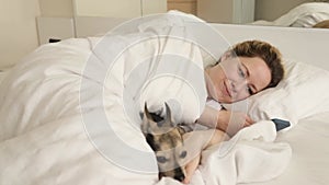 a woman in bed with a phone in the morning, Online chats, pet shop, online banking