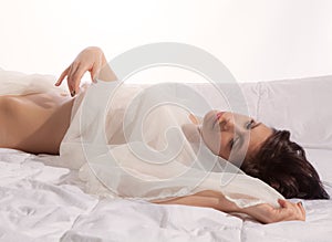 Woman on Bed With Sheer Fabric photo
