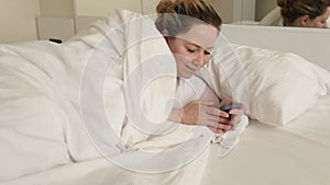 a woman in bed with smartphone, Online chats, social networks