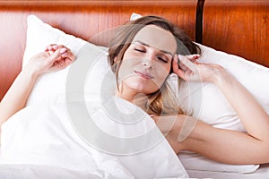 Woman in bed with sweet dreams