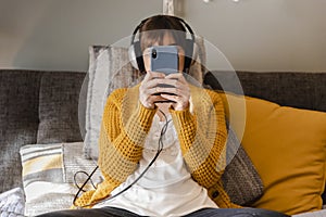 Woman on bed texting