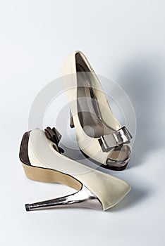 Woman beige shoes on white