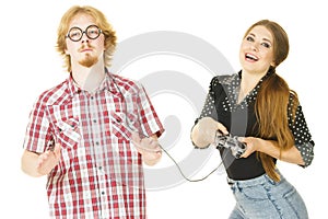 Woman controling man using gaming pad