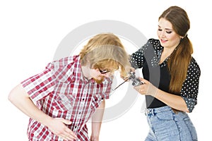 Woman controling man using gaming pad