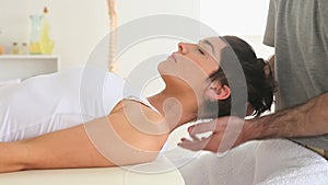 Woman being massaged at the neck