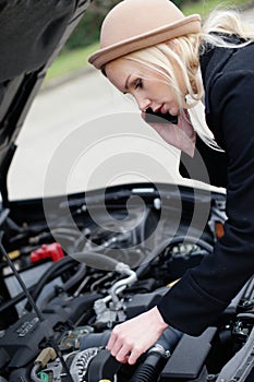 Woman being talked through roadside assistance