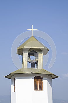 Woman bell-ringer in orthodoxy church bell tower