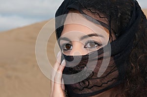 woman belly dancer arabian in desert dunes
