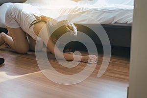 Woman bent and searching something under bed lost thing