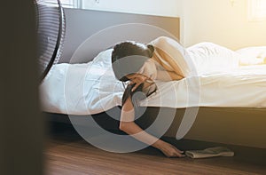 Woman bent and searching something under bed lost thing