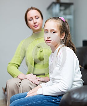 Woman berating daughter in home