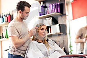 Woman at beuty salon doing hair color treatment