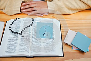 Woman, bible study and question on sticky note, rosary and god for worship, religion and spiritual. Christian, faith and