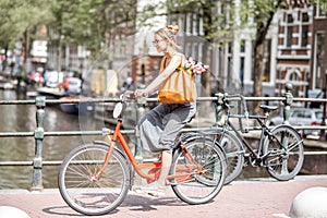 Woman with bicycle in Amsterdam city