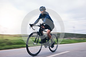 Woman, bicycle and nature road with motion blur for fitness, health and eco friendly travel on summer adventure. Cycling