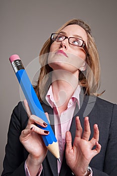 Woman with a big blue pencil