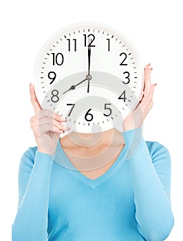 Woman with big clock covering face