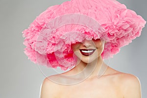 Woman Big Hat and Lips. Model wearing Fabric with lace ruffles hat. High Fashion Model fabric crown or hairstyle