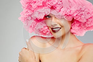 Woman Big Hat and Lips. Model wearing Fabric with lace ruffles hat. High Fashion Model fabric crown or hairstyle