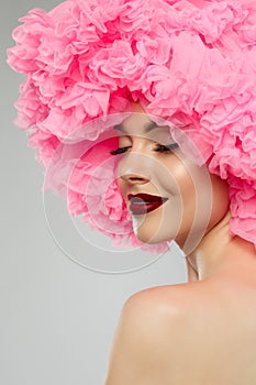 Woman Big Hat and Lips. Model wearing Fabric with lace ruffles hat. High Fashion Model fabric crown or hairstyle