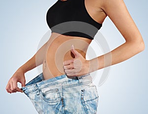 Woman with big jeans weight loss