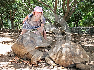 Woman and big turtles