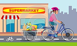 Woman on bike with groceries