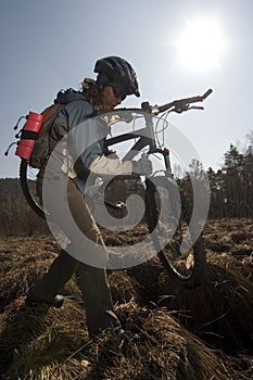 Woman biker in swampland