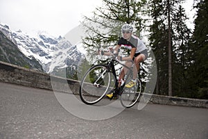 Woman biking - downhill road cycling