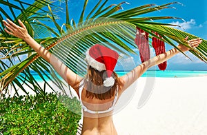 Woman in bikini on a beach at christmas