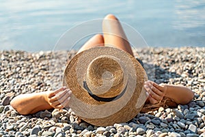 Woman bikini beach tan. Happy woman in swimwear and hat on vacation. Summer travel holidays vacation on the sea