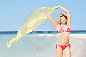 Woman In Bikini On Beautiful Tropical Beach Holding Sarong